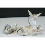 Two Lladro Figures - Donkey with Daisy, 17cms long and Duck with Ducklings in a Basket, 10cms long