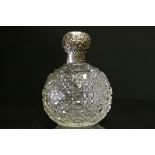 A fully hallmarked sterling silver topped cut glass scent bottle & stopper with a maker mark for