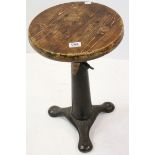 Singer sewing machinist stool, circular wooden seat on heavy adjustable cast iron base, 'SINGER'