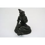 A bronze indian seated deity, stands approx 11cm in height.