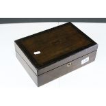An antique mahogany writing slope with painted decoration to lid.