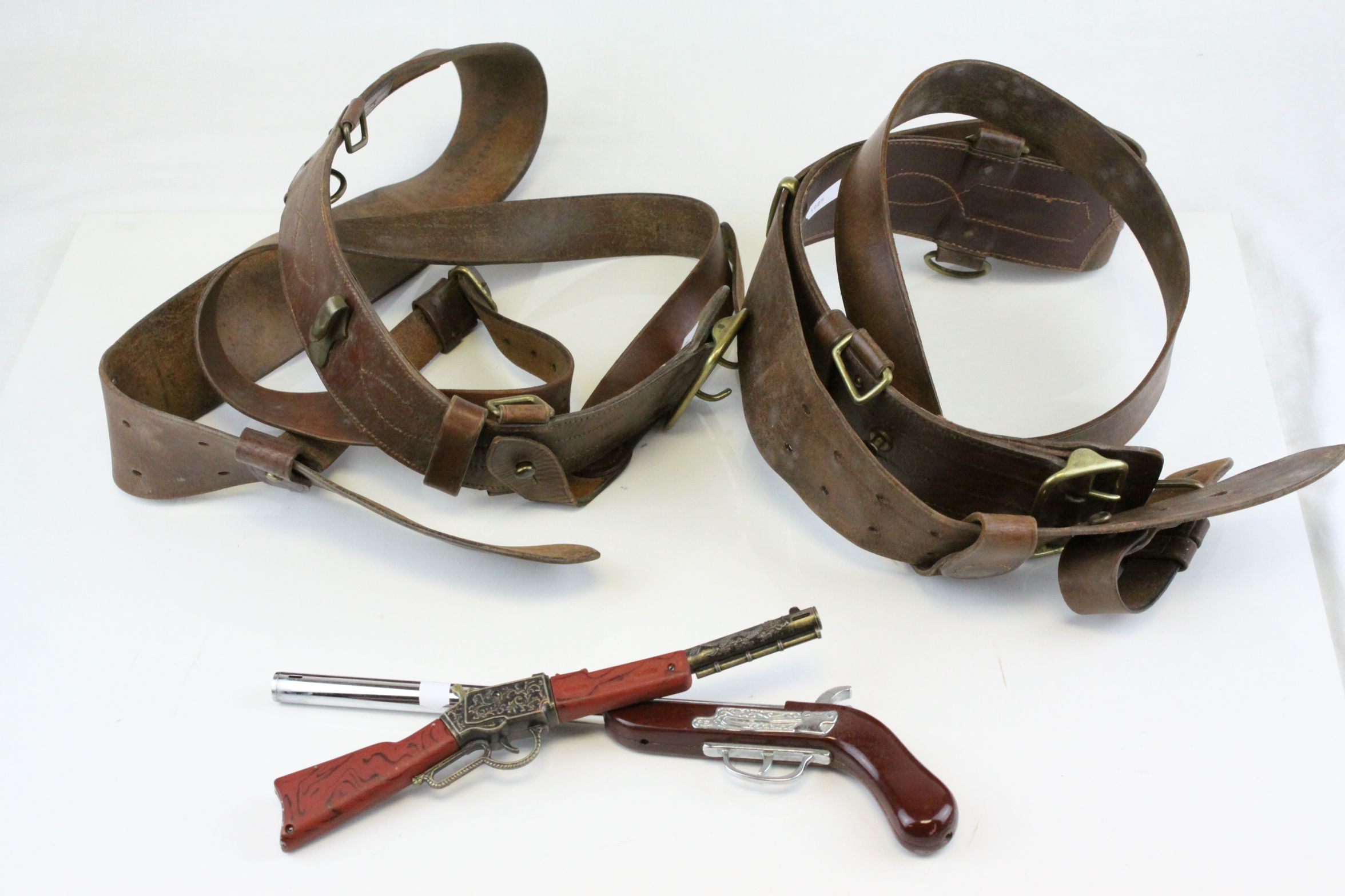 Two Sam Brown Leather Belts together with Two Novelty Shotgun Lighters