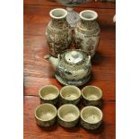 A group of Japanese ceramics to include a pair of Satsuma vases, a teapot and stand with six tea