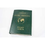 A globe trotter stamp album with contents to include British and world stamps.