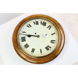 Late 19th / Early 20th century Oak Cased Circular ' School ' Type Wall clock with Roman Numerals