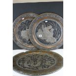 Three Indian Coppered and Silvered Trays with relief decoration depicting Indian Figures, oval