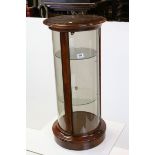 Circular Glazed Display Cabinet with Two Glass Shelves raised on plinth base, h.88cms d.40cms