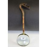 Large Magnifying Glass, the long wooden handle carved in the form of a Bird's Head, l.38cms