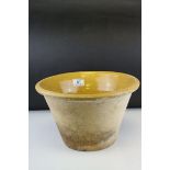 Late 19th / Early 20th century Dairy Bowl with Yellow Mustard Glazing to the interiors, h. 19cms