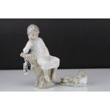 Two Lladro Figures - Boy with Book sat on a Tree, 21cms high and Baby sleeping on a Pillow, 10cms