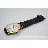 A gents watch on leather strap