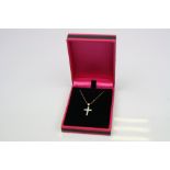 An 18ct yellow gold diamond cross pendant necklace