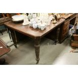Late Victorian Mahogany Wind-Out Dining Table raised on turned ringed legs and terminating in