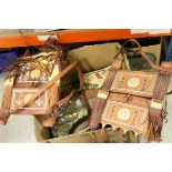 Four Moroccan leather shoulder bags with tooled and beaded decoration together with a cushion and