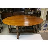 Georgian style Oak Drop Leaf Dining Table of oval outline, on baluster turned legs, L.210cms H.