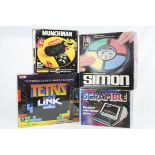 Four boxed games to include Tomy Munchman, Grandstand Scramble, MB Simon & sealed Ideal Tetris Link