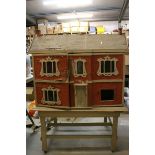 Mid 20th C Dolls House, double fronted with additional rear opening, showing wear and grubby