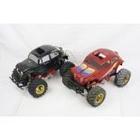 Two vintage Tamiya electric Hump Back 1/10 scale Monster Beetle radio control cars on Blackfoot