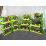 12 Boxed 1/32 Britains John Deere diecast tractor models to include 956ORT, 5430i Self Propelled