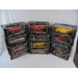 12 Boxed 1/18 Burago diecast models, diecast vg, all with faults to boxes including water damage