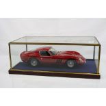 Cased 1:12 scale unmarked diecast Ferrari 250 GTO, model fixed to wooden plinth and well presented