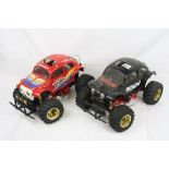 Two vintage Tamiya electric Hump Back 1/10 scale Monster Beetle radio control cars on Blackfoot