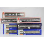 Seven boxed HO / OO gauge items of rolling stock to include 3 x ROCO Professional and 4 x Lima,