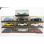 Ten cased 1:18 scale diecast model classic cars to include, Porsche Carrera, VW Beetle, Ferrari,