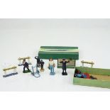 Group of Dinky and Hornby metal and plastic station figures and signs contained in a Dinky Figures