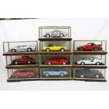 Ten cased 1:18 scale diecast model classic cars to include Lamborghini, Porsche, Jaguar etc,