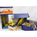 Four boxed Dinky Supertoys diecast models to include 564 Elevator Loader, 562 Dumper Truck, 571