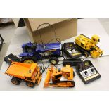 Four r/c construction and farming models to include Toy State Farm Tractor, 2 x New Bright CAT