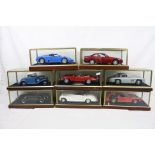 Eight cased 1:18 scale diecast model classic cars to include Jaguar E-Type, Mercedes, BMW etc,