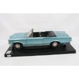 Diecast 1:8 scale Pontiac GTO model, mounted on plastic stand