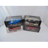 Four boxed 1/18 Burago diecast models to include 3032 Ferrari F40 (1987), 3055 Bugatti EB110 (1991),