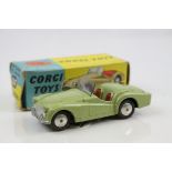 Boxed Corgi 305 Triumph TR3 Sports Car diecast model in metallic green, diecast vg, box fair-gd with