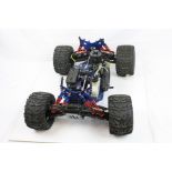 A Kyosho 4WD Monster Truck radio controlled truck chassis with power 4.01 Force 25 engine.