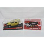 Two boxed Nimco slot cars to include 50457 Hummer H2 yellow and 55025 Renault Megane Trophy 09