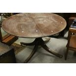 Circular Mahogany Table Top of Turned Column with Four Splay Feet with Castors, 124cms diameter