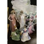 A group of figurines to include Royal Doulton Grace,Valerie, Worcester Masquerade and two Nao