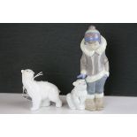 A Lladro figure of an inuit child with polar bear and a Nao bear.