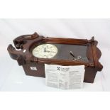 A Howard Miller Westminster chime mahogany cased wall clock.