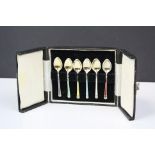 A cased set of six fully hallmarked sterling silver and enamel coffee spoons.
