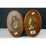 Pair of Oak Oval Wall Plaques mounted with Brass Side Profiles of Romans, 23cms high