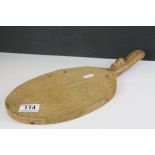 Mouseman Oak Cheese Board of oval form and mouse carved to handle, 38cms long