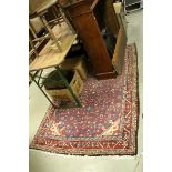 Red and Blue Ground Eastern Wool Rug with Stylised Floral Pattern with a Border, approx. 198cms x