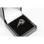 A 925 sterling silver ring with Blue John cabochon centre stone.