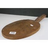 Mouseman Oak Cheese Board of oval form and mouse carved to handle, 39cms long