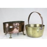 An antique brass jam pan with iron handle together with an oval copper pan raised on claw feet maker