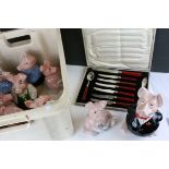 Nine Wade Nat West Pig Moneyboxes together with a Cased Art Deco Cutlery Set with Red Bakelite